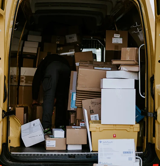 Open back of courier van, with packages inside