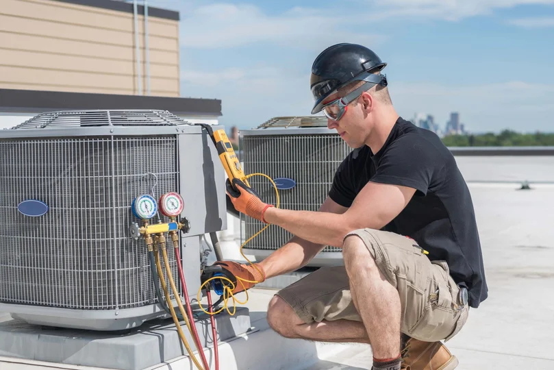 HVAC technician servicing equipment